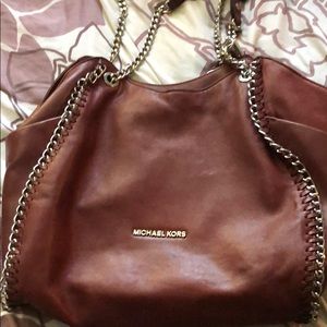 Maroon Michael Kors handbag.